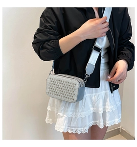 Silver rhinestone camera bag with wide fabric strap shown on a model for actual fit