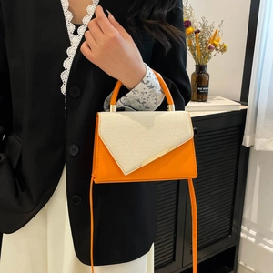 Modern orange and beige patchwork crossbody bag with metallic handle for women