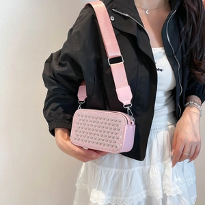 Pink rhinestone crossbody bag for women with a wide adjustable shoulder strap and sparkles