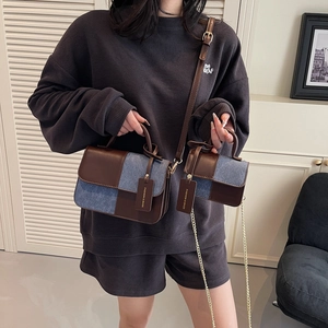 Retro denim and brown leather handbag set with mini chain bag shown in use