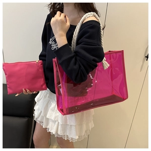 Detail of rose pink transparent PVC tote bag with white rope handles and inner pouch