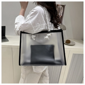 Detailed side view of clear frosted PVC tote bag with black inner pouch and rope straps