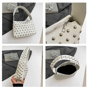 Détails du sac à main blanc clouté montrant les rivets argentés et le cuir synthétique