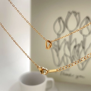 Vintage 18K gold knotted ring pendant necklace with polished chain for women