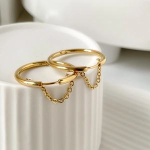 Golden titanium steel hoop earrings with elegant hanging fringe chain detail