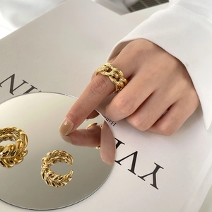 French style gold plated twisted rope ring shown with hand model and mirror reflection