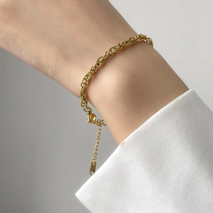 Elegant gold-plated titanium twisted rope chain bracelet with extension and lobster clasp