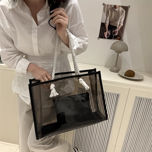 Black transparent PVC tote bag with white rope handles and inner pouch for women