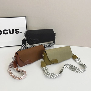 Minimalist leather shoulder bags in black, brown, and green with wide geometric straps