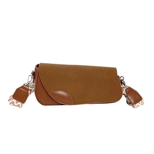 Chic brown suede shoulder bag with retro design and patterned wide woven strap