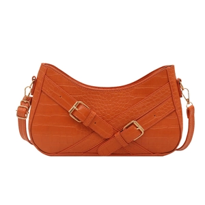 Orange crocodile-embossed crescent underarm bag with decorative straps and gold hardware