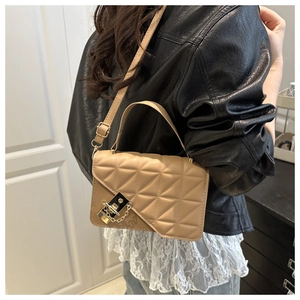 Detail of khaki square crossbody bag with quilted geometric pattern and gold buckle