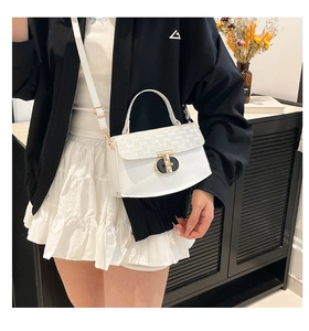 Detailed shot of white faux leather crossbody bag with letter print and metal T-lock