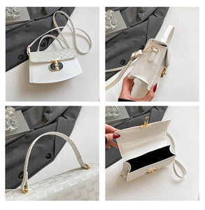 Detail view of white PU leather crossbody bag featuring gold metal clasp and logo pattern