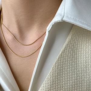 Double-layered gold snake chain necklace for women featuring minimalist twisted design