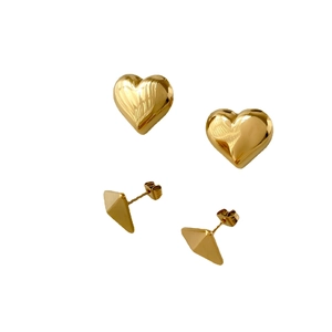 Set of two gold-plated earrings featuring heart shapes and geometric triangle designs