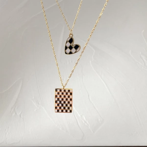 Gold chain necklaces with black and white checkerboard heart and rectangle pendants