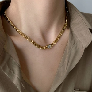 Golden Cuban link chain necklace featuring a rectangular white zircon centerpiece for women