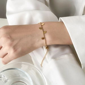 Elegant gold leaf pendant bracelet for women with adjustable chain and minimalist metal charms