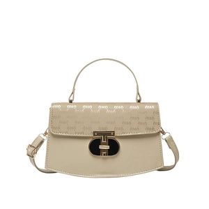 Cream vintage leather crossbody bag with monogram pattern flap and metal T-lock