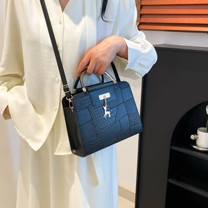 Black crocodile pattern handbag with gold metal handle and deer pendant for women