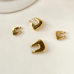 Elegant gold geometric U-shaped hoop earrings in two sizes with polished finish