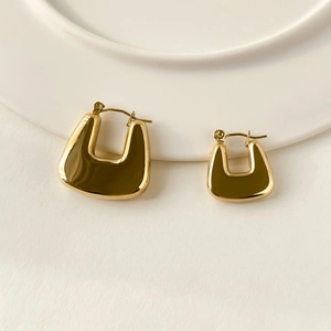 Polished gold U-shaped geometric hoop earrings in small and large size comparison