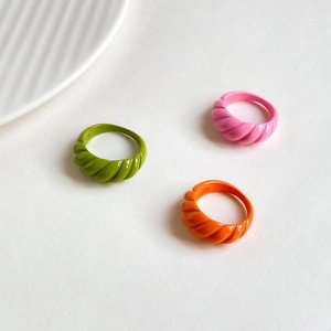 French vintage style colorful enamel rings with spiral pattern in green, pink, and orange