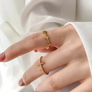 Elegant gold geometric wave ring and beaded cross ring set for women's jewelry