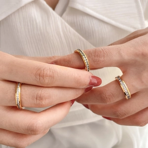Elegant 18K gold plated titanium steel ring featuring a row of sparkling cubic zirconia