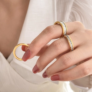 Three-piece gold plated titanium steel stackable rings set with clear baguette zirconia stones