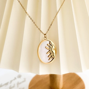 Golden sun medallion necklace with mother of pearl inlay on minimalist box chain