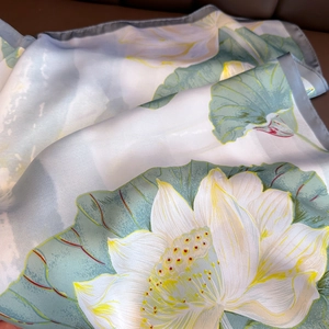 Elegant vintage silk scarf featuring blue lotus patterns and refined grey stitched edges