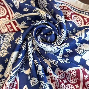 Elegant silk scarf with Nordic house and reindeer pattern in navy blue and red