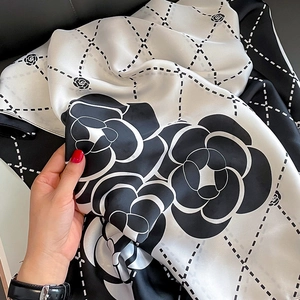 Silk-like camellia scarf with black and white floral pattern and diamond grid pattern
