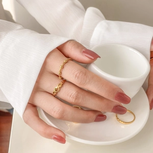 Elegant gold-plated geometric ring set with bead, hollow link and wavy textures for women