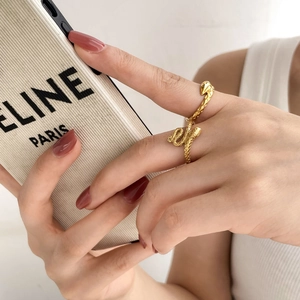 Vintage gold snake wrap open ring with intricate scale texture on model's hand