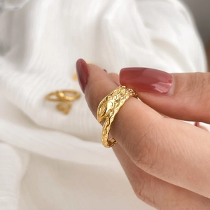 Vintage gold snake wrap open ring with detailed scale texture on hand model