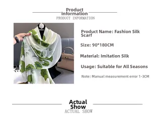 Detail of faux silk scarf with green ginkgo leaf print and 90x180cm dimensions