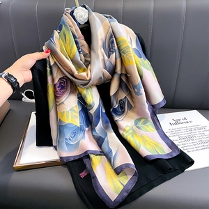 Elegant floral satin silk scarf with blue-purple roses and yellow leaves on black clothing