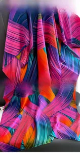 Detail of colorful geometric silk scarf showing clean hem stitching and vibrant fabric texture