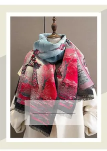 Detail of artistic color-block winter shawl with elegant black tassel fringe