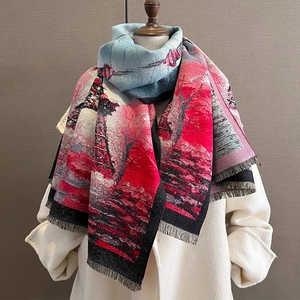 Thick winter scarf with artistic nature print and fringes on a white coat model