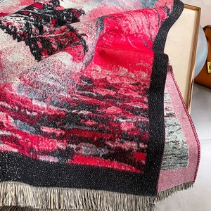 Detail of artistic landscape pattern on soft scarf with fine fringe edging