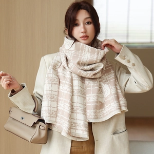 Detail of beige cashmere-feel scarf with grid floral pattern and delicate soft fringes