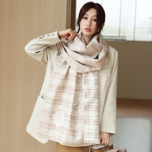 Detail of camellia floral pattern on warm cashmere-like thick scarf with soft fringe
