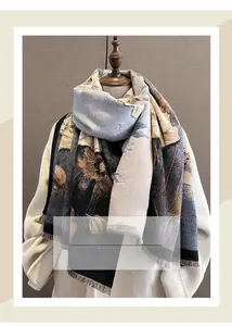 Detail of floral cashmere-like scarf showing fringe edges and vintage artistic pattern