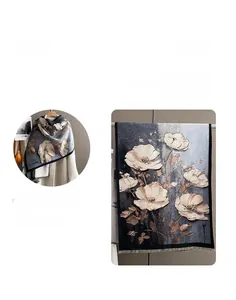 Detail of floral cashmere scarf with dense knit texture and short fringe edges