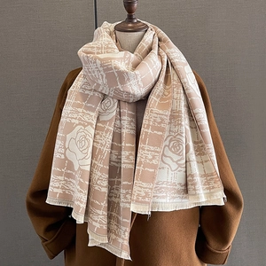 Thick camellia pattern cashmere-like scarf with fringe on a model mannequin