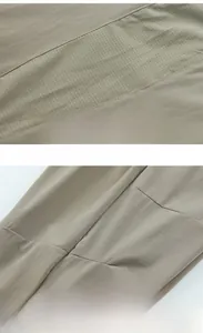 Dettaglio dei pantaloni sportivi kaki con inserti in mesh e cuciture ergonomiche sul ginocchio